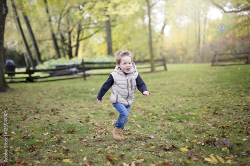 boy in autumn season in a park © Louis-Photo