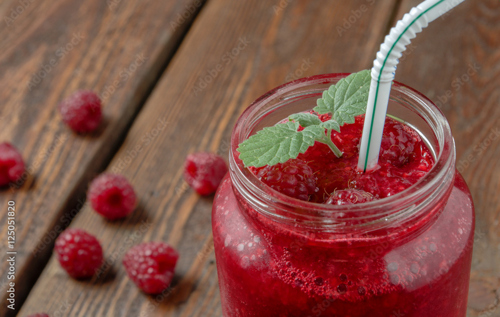 Raspberry smoothie with mint in glass jar with straw Raspberry smoothie with mint in glass jar with straw