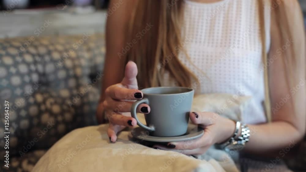 Female hands hold cup of coffee Female hands hold cup of coffee