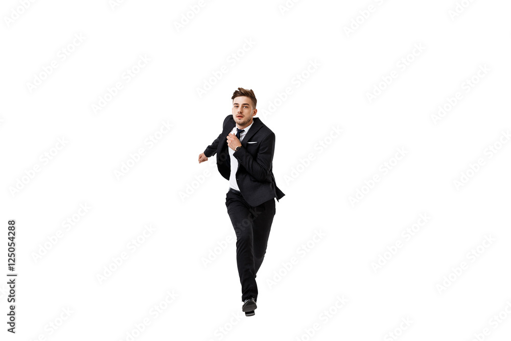 Young successful businessman in suit running over white background. Young successful businessman in suit running over white background.