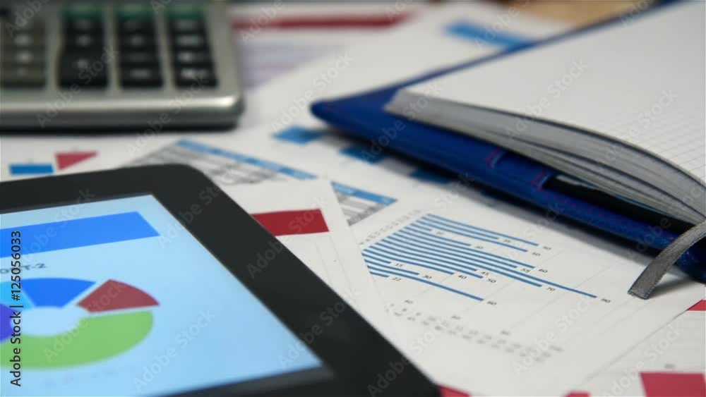 Office Desktop With Start Up Report On Digitaal Tablet Screen Office Desktop With Start Up Report On Digitaal Tablet Screen