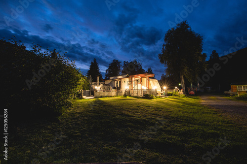 Obraz na płótnie Norway camp house in the summer night. Blue sky. Adventure trip to norway. w salonie