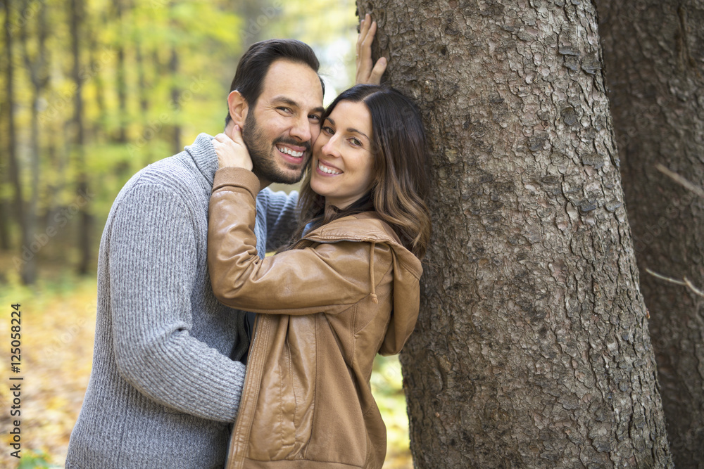 Nice couple having fun in autumn park Nice couple having fun in autumn park