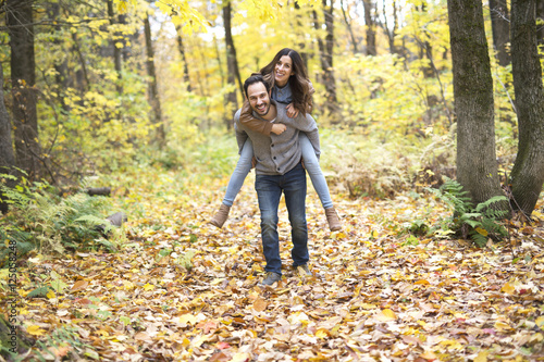 Nice couple having fun in autumn park © Louis-Photo