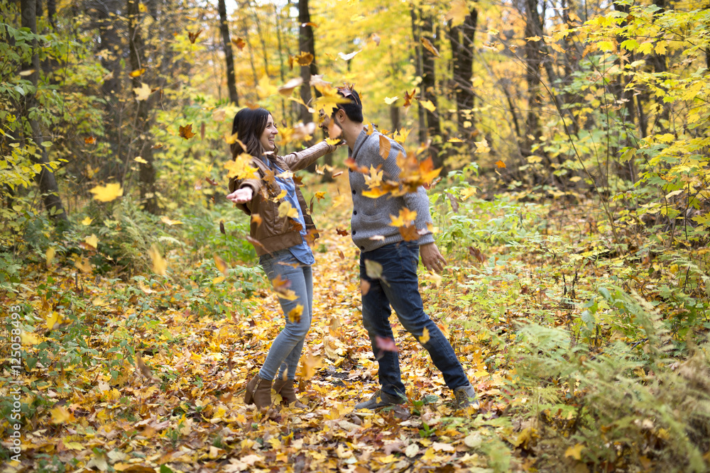 Nice couple having fun in autumn park Nice couple having fun in autumn park
