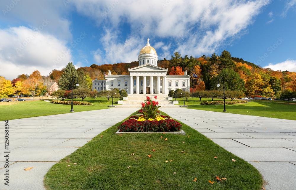 The Vermont State House with Colorful Foliage in Background.  Located in Montpelier, the house is the state capitol of Vermont, in the United States. 