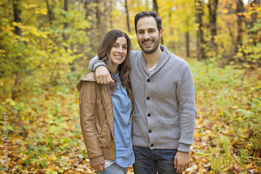 Nice couple having fun in autumn park Nice couple having fun in autumn park