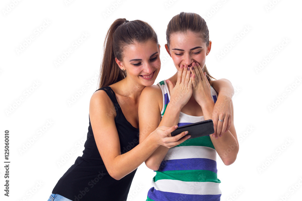 Two young women using smartphone Two young women using smartphone