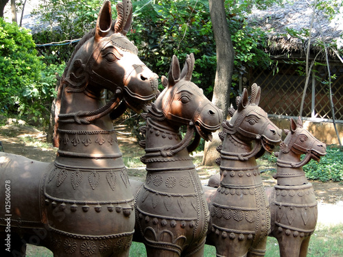  Terra cotta horses in folk art garden photo