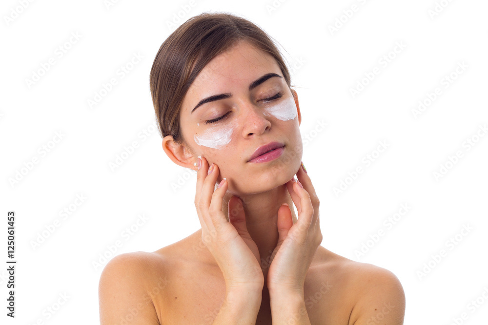 Young woman using cream Young woman using cream