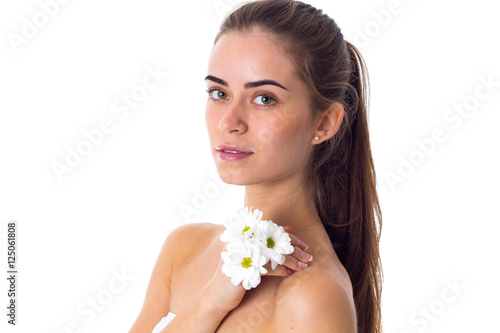 Young woman holding white flowers