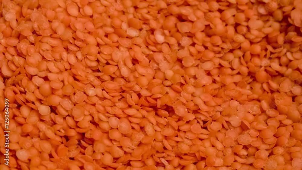 Closeup of uncooked split red lentils Closeup of uncooked split red lentils