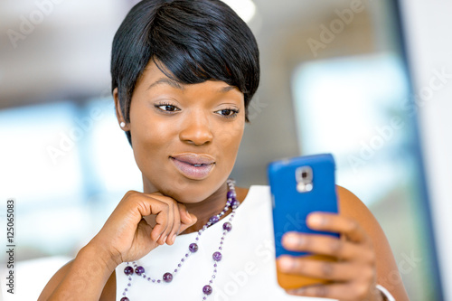 Portrait of smiling business woman with mobile