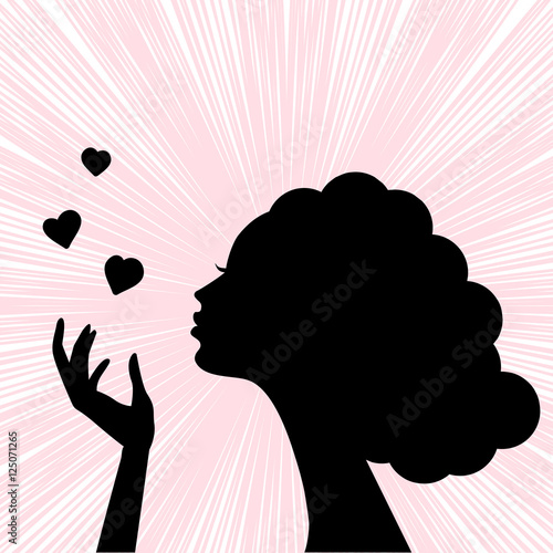 Beautiful woman face silhouette with heart kiss