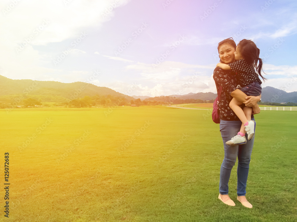 Couple of asian mother and daughter.Lovely mother and daughter hugging on the field. Couple of asian mother and daughter.Lovely mother and daughter hugging on the field.
