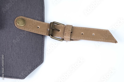 leather belt on camera bag.