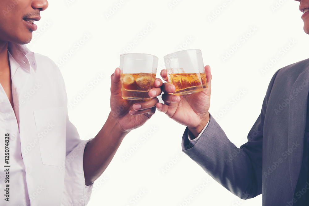 Two businessman in shirt and tie talking to each other while drinking whisky after office hour. Two businessman in shirt and tie talking to each other while drinking whisky after office hour.