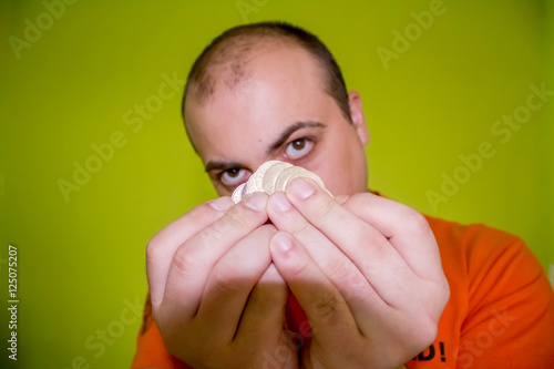 Fototapeta Naklejka Na Ścianę i Meble -  Dude holding a few coins