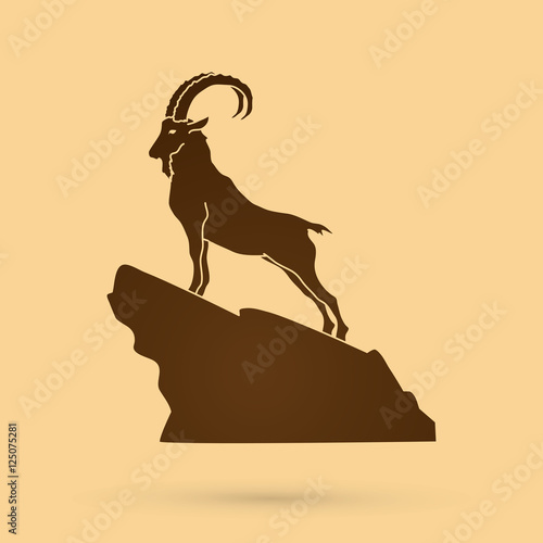 Ibex standing on the cliff graphic vector. photo