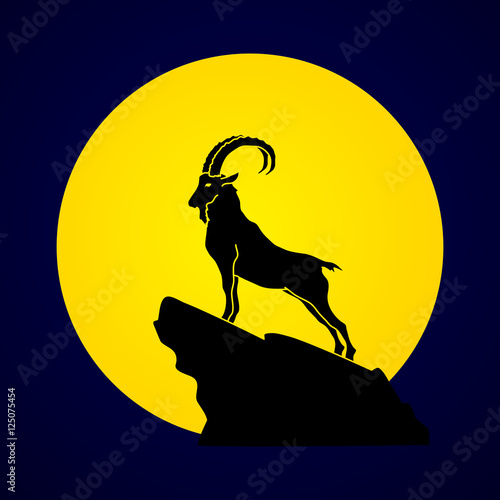 Ibex standing on the cliff designed on moonlight background graphic vector.
