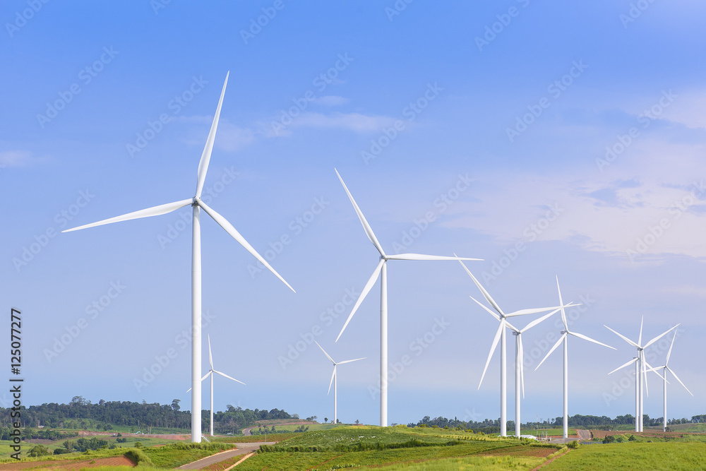 The big windmill turbine farm with the blue sky The big windmill turbine farm with the blue sky