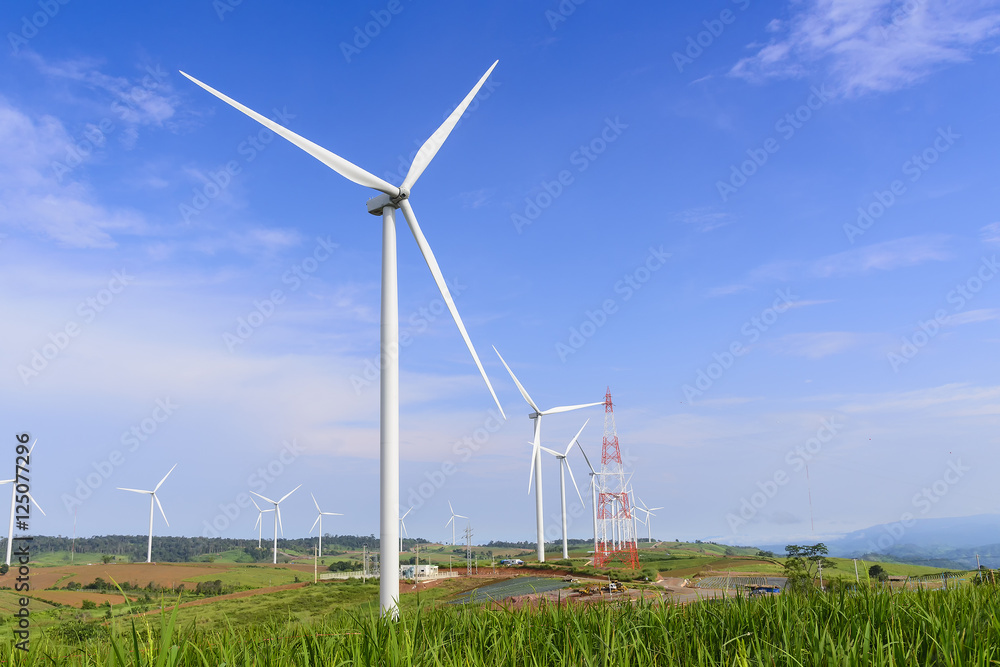 The wind turbine farm on the top of mountain with the sky and cloud The wind turbine farm on the top of mountain with the sky and cloud