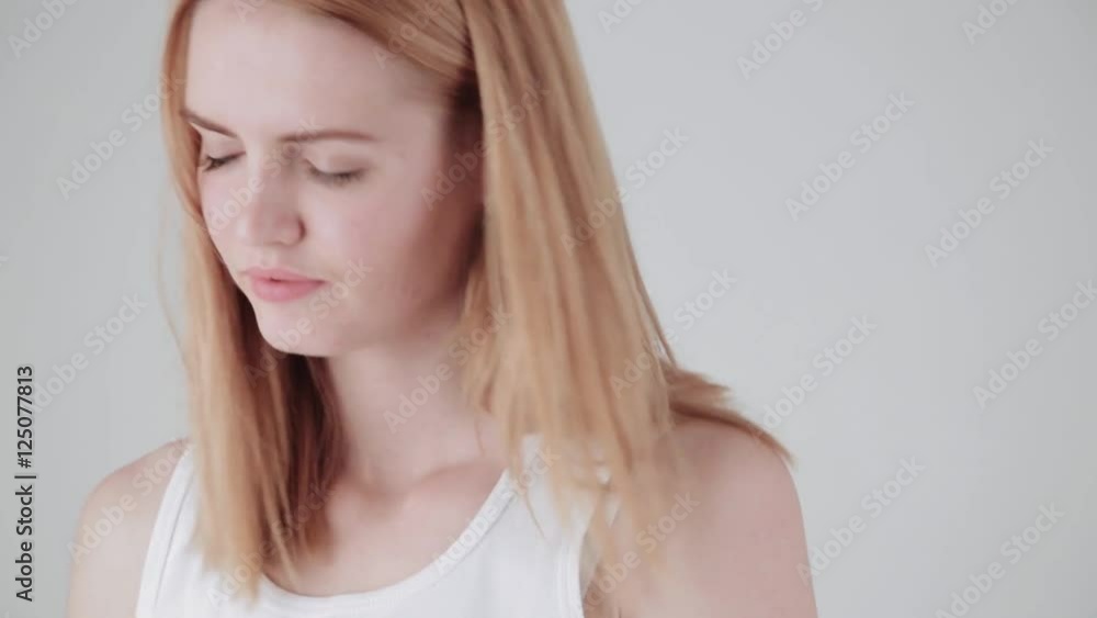 Close up portrait of girl slow dancing and listening to the music isolated on a light background. Properly color corrected version Close up portrait of girl slow dancing and listening to the music isolated on a light background. Properly color corrected version