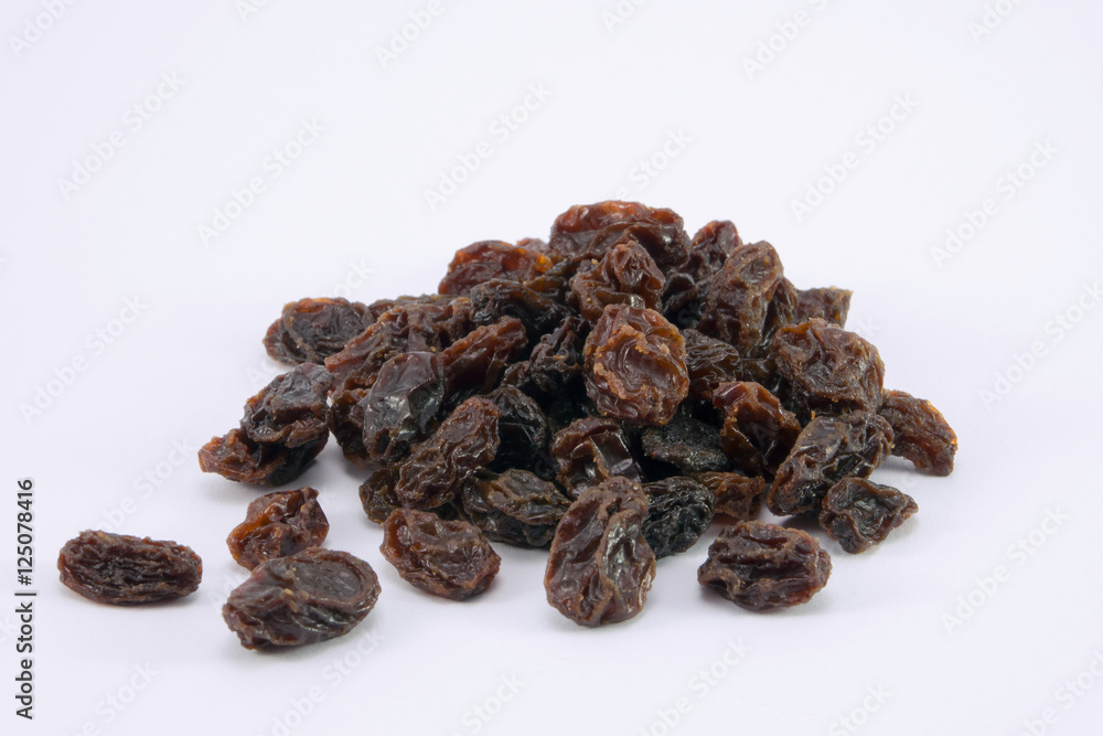 Dried raisins on a white background Dried raisins on a white background