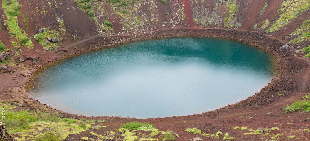 Kerid is a crater lake of a turquoise color - Iceland