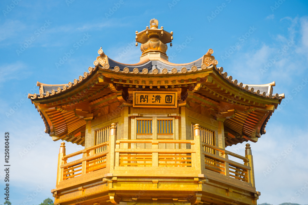 Fototapeta premium The golden pavilion and red bridge at Nan Lian garden, Hong Kong