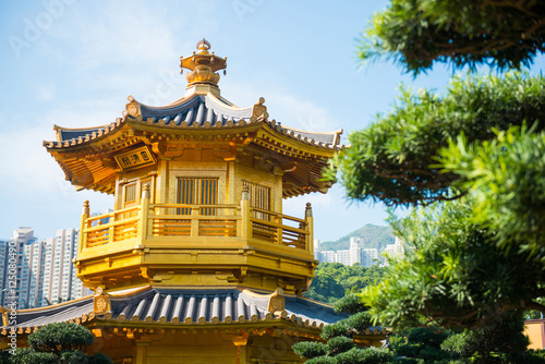 The golden pavilion and red bridge at Nan Lian garden  Hong Kong