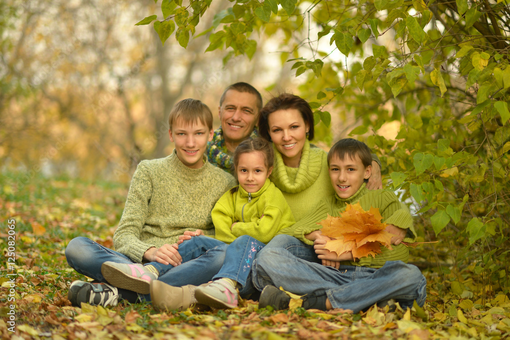Family relaxing in autumn park Family relaxing in autumn park