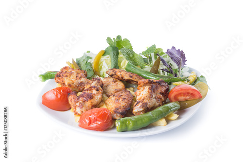 Grilled chicken wings with garnitures, tavuk kanat - Clipping path inside