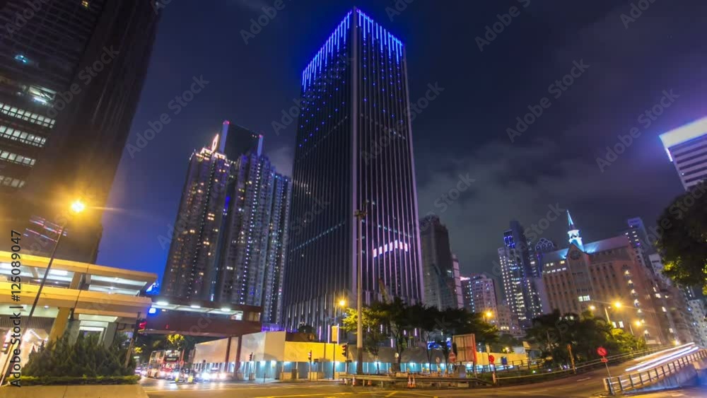 Night view hyperlapse of modern city traffic across street with skyscrapers. Time lapse. Hong Kong Night view hyperlapse of modern city traffic across street with skyscrapers. Time lapse. Hong Kong