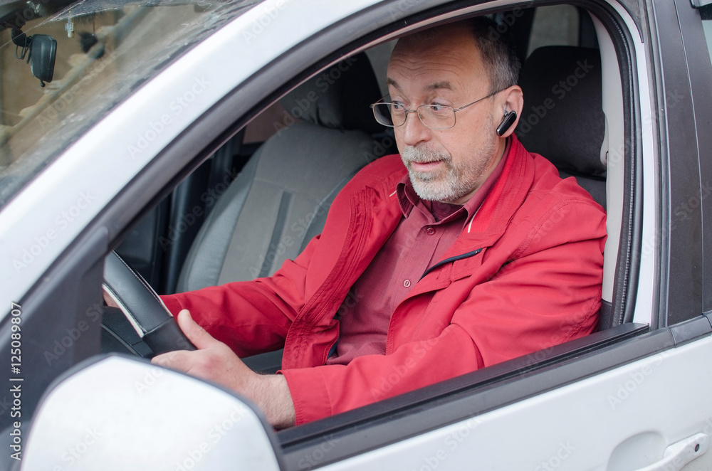 Aged man talking on the phone Aged man talking on the phone