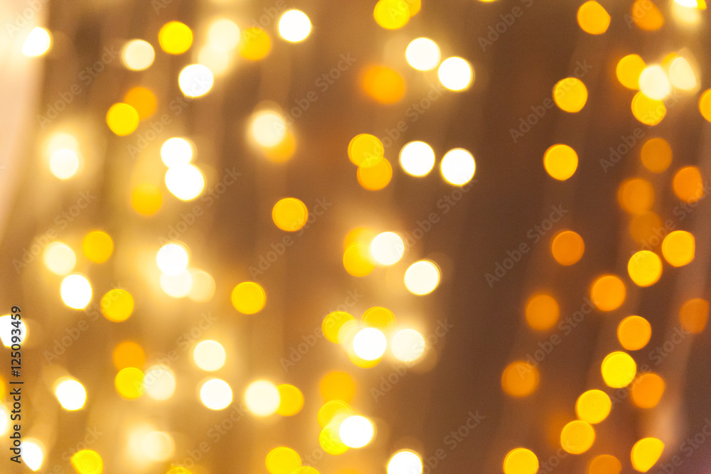 Obraz premium Christmas background with golden bokeh lights