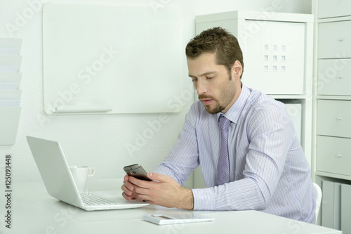 Elegant businessman with computer