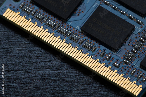 Computer memory chip on a dark wooden background