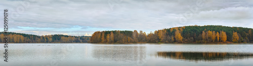 Fototapeta Naklejka Na Ścianę i Meble -  Beautiful panoramic view of fall forest lake..Panorama from five photos..