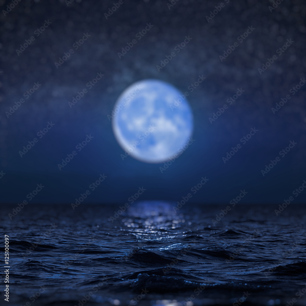 Full moon rising over empty ocean at night, blur background
