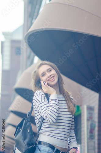 Young woman using her phone © retoncy