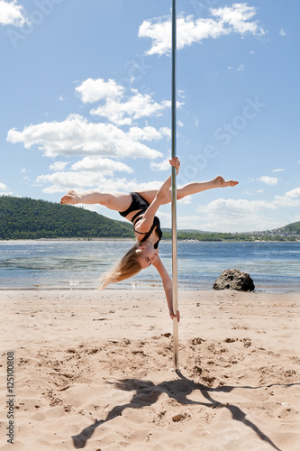 dancer on pole summer river beach