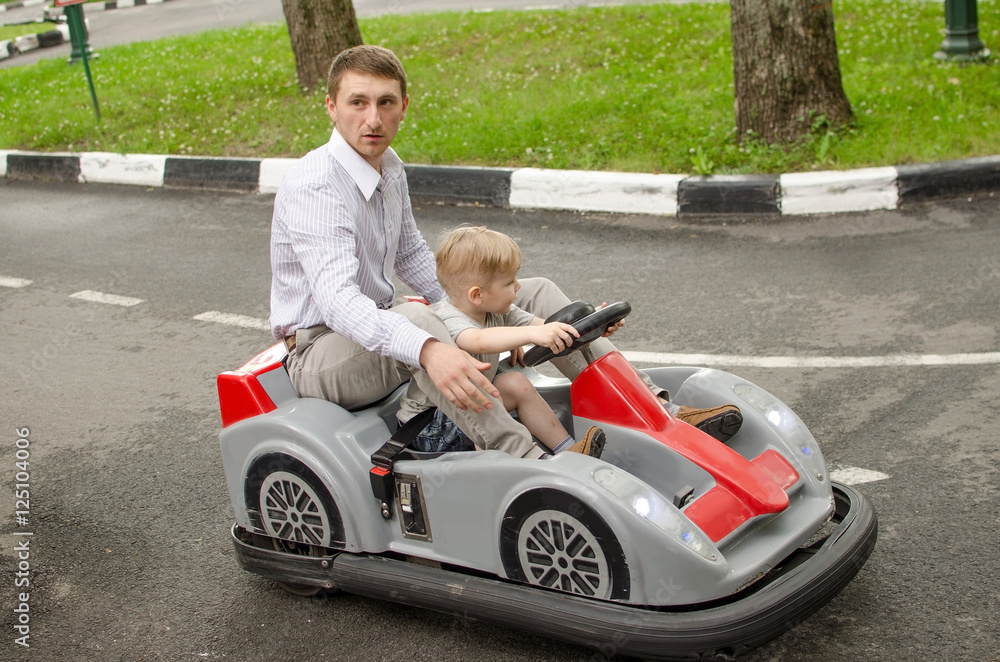 Small baby boy is enjoying driving small car Stock Photo Adobe Stock