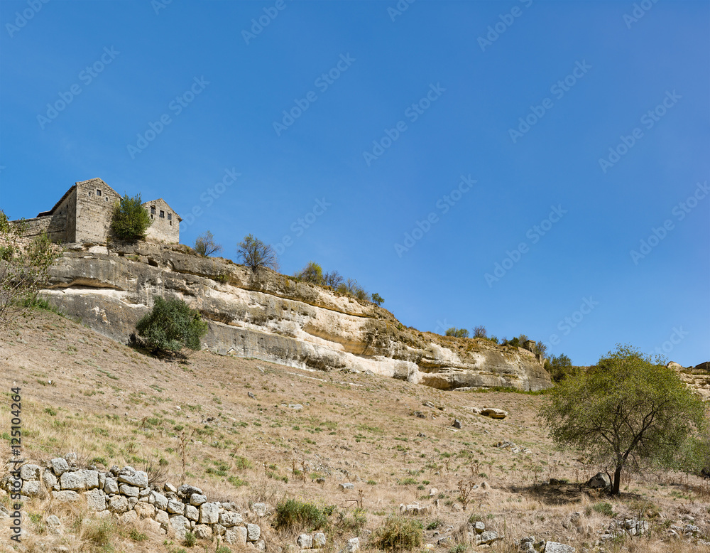 View of the city-fortress Chufut-Kale from the southern slope and beams Maryam-Dere in the early autumn