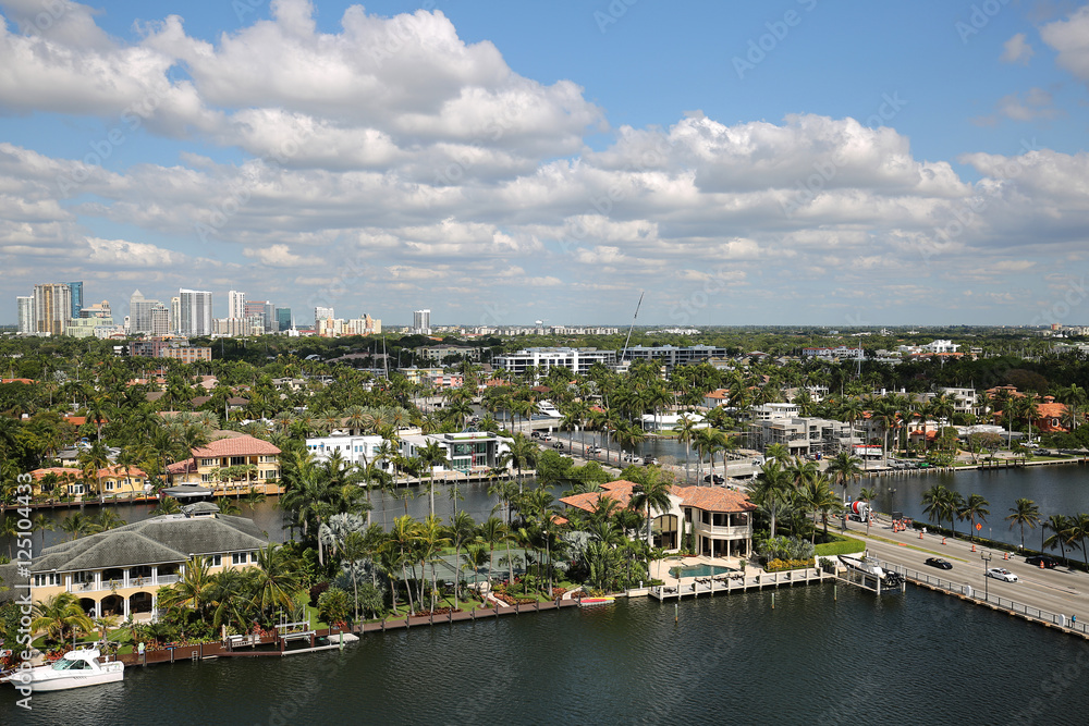 Fort Lauderdale skyline and upscale residential homes along Las Olas Boulevard