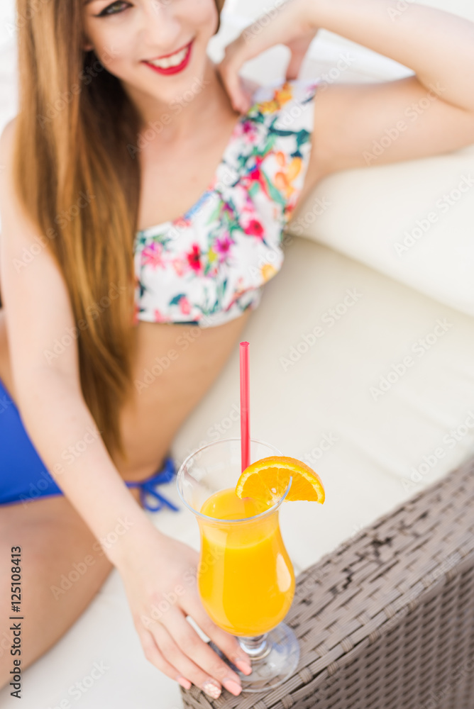 Sexy woman drinking cocktail in summer and enjoying her vacation Sexy woman drinking cocktail in summer and enjoying her vacation