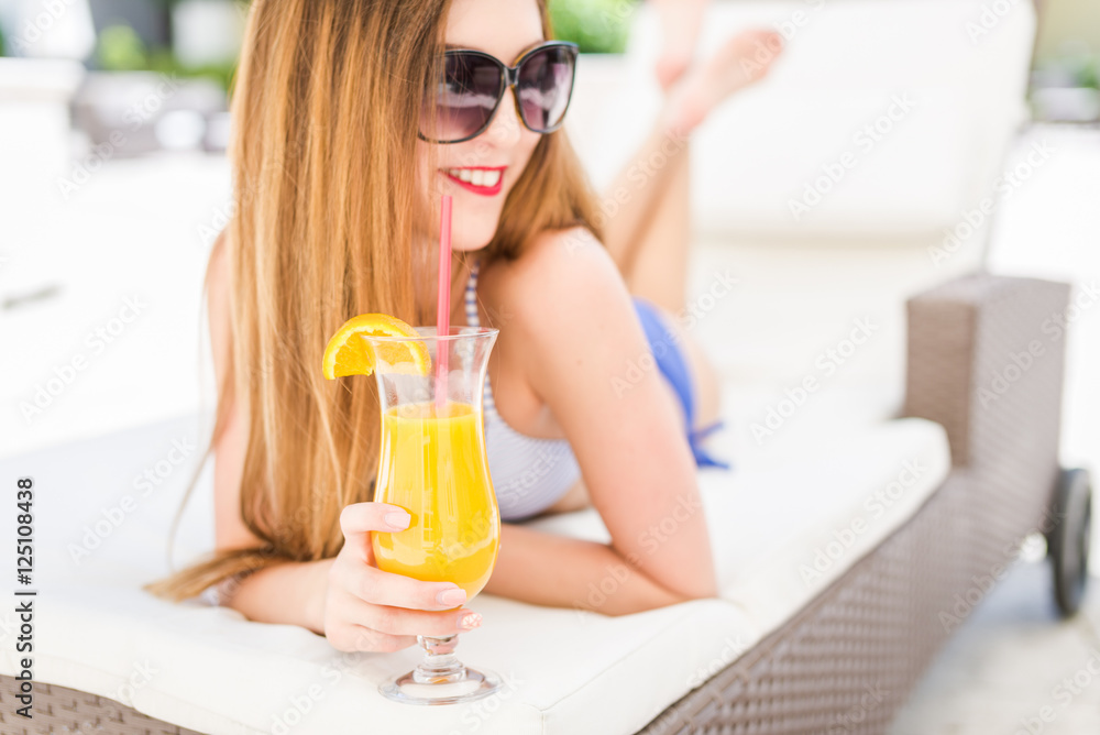 Sexy woman drinking cocktail in summer and enjoying her vacation Sexy woman drinking cocktail in summer and enjoying her vacation