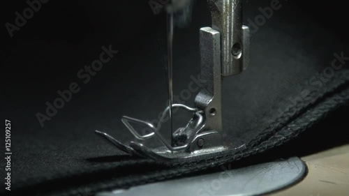 Wallpaper Mural A sewing machine in motion. Close-up of sewing machine needle rapidly moves up and down. Close-up of sewing machine parts. Foot needle. Needle plate. Sewing. Create a line. Sewing needle. Torontodigital.ca