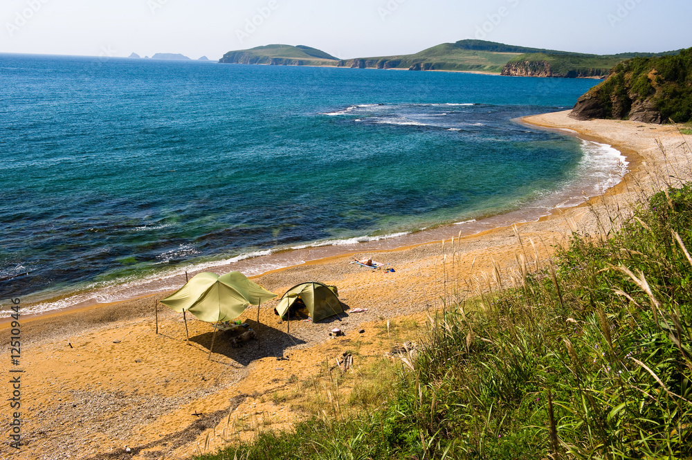 lone camping on desert beach on the russian isle Putyatin