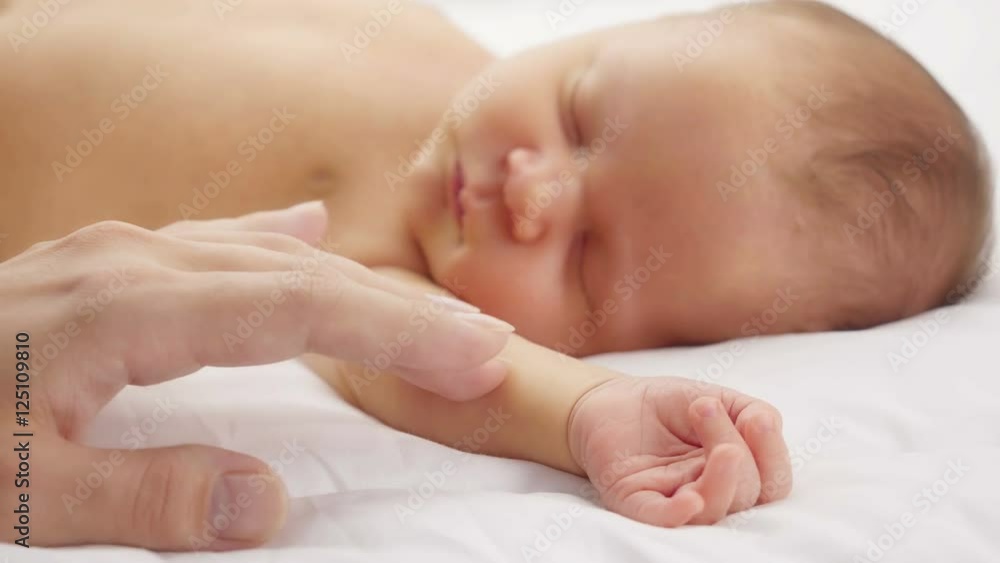 Mother caresses the newborn.
Mother caresses the newborn.